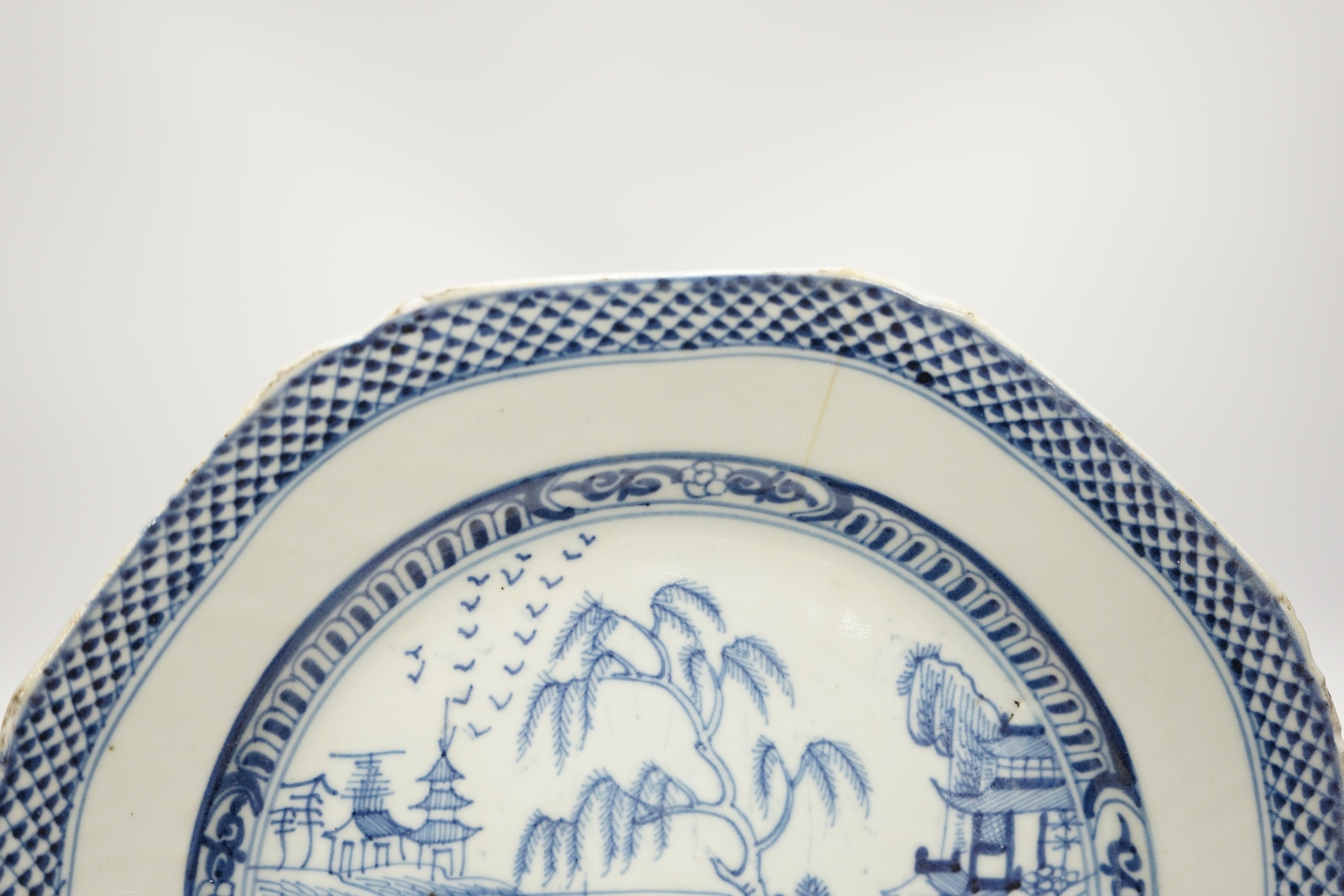 Four various Chinese export blue and white dishes, 18th/19th century, largest 26cm, largest 26cm diameter. Condition - one plate cracked, chips to another